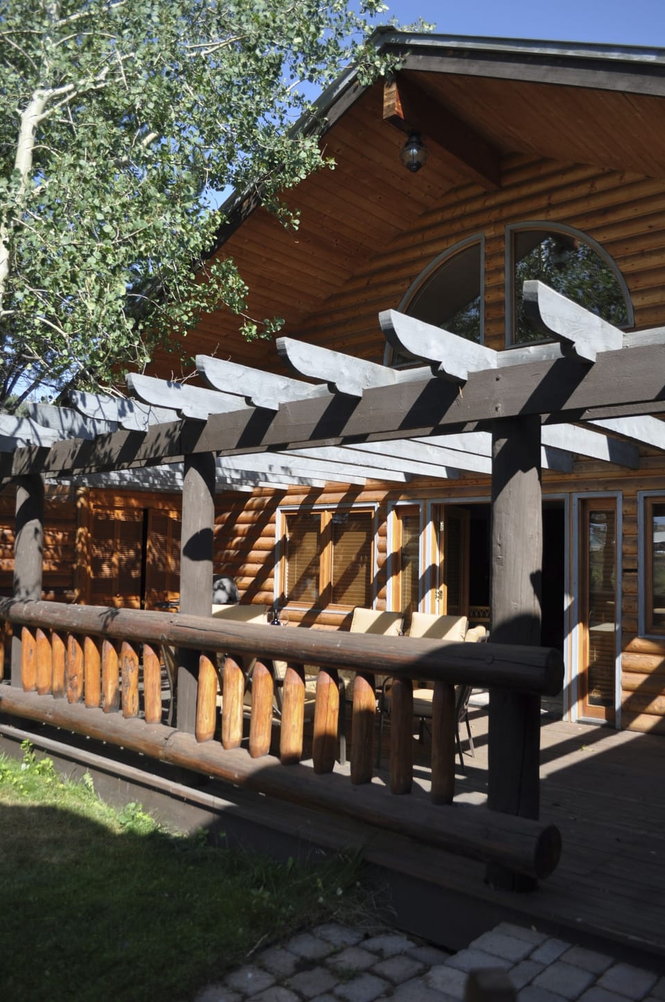 Large guest cabin with private deck and small yard.
