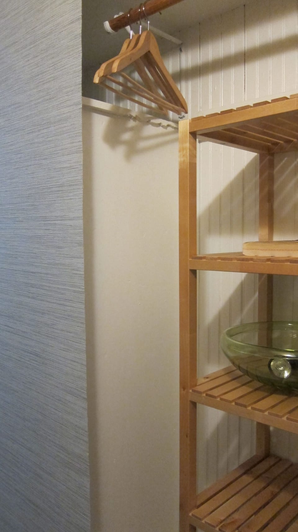 One of the two closets in the hallway of the condo, third one in the bedroom.