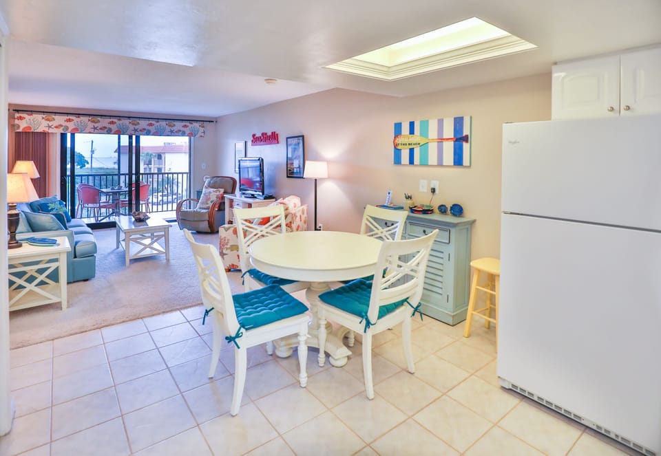Newer dining room table and chairs and open to the kitchen area.