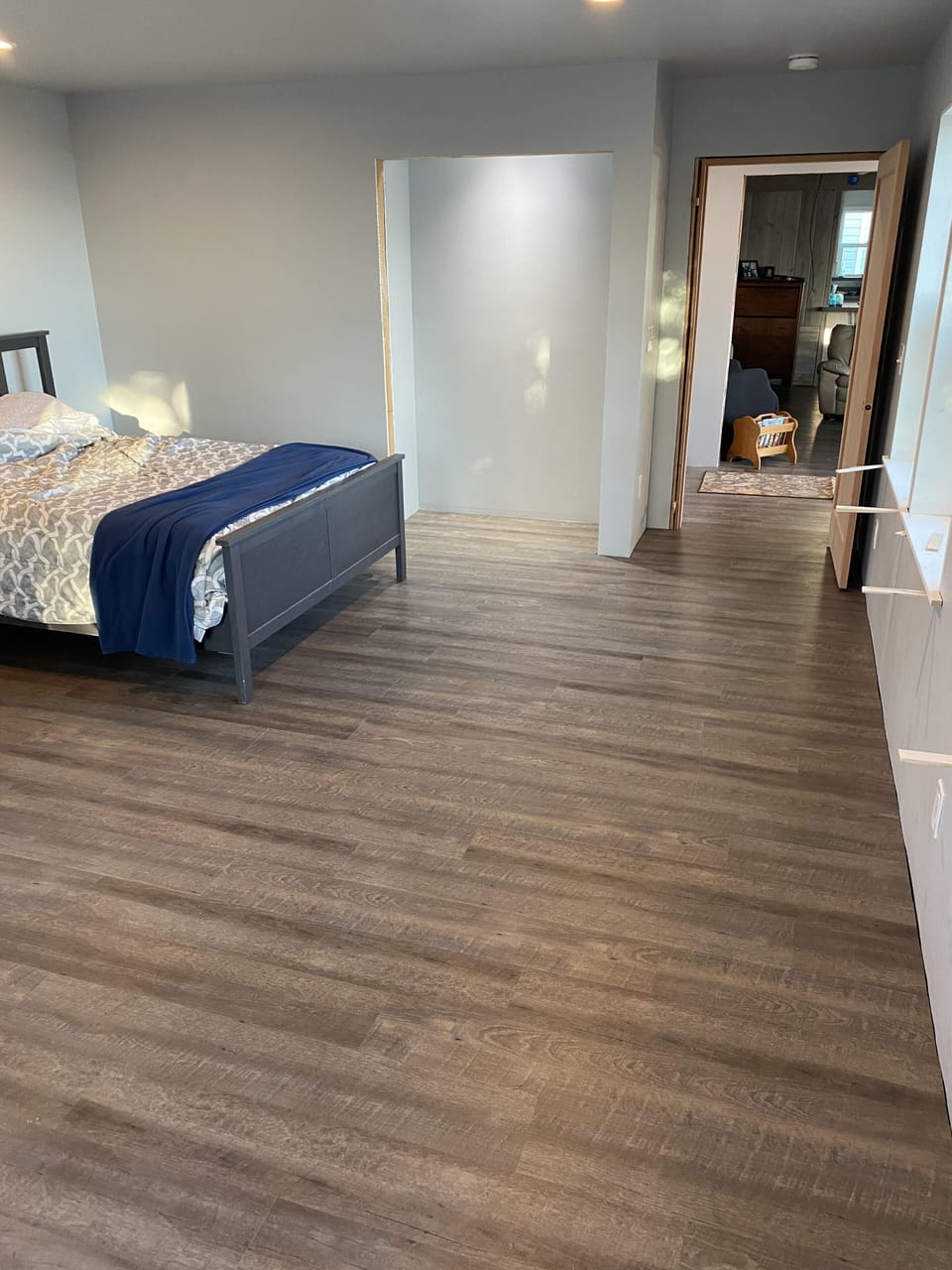 New Primary bedroom with queen bed.  Room for a power chair on all sides