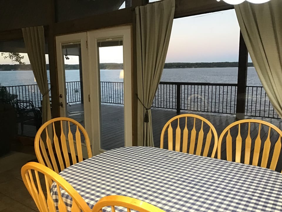 Kitchen overlooking deck and lake on main floor 
