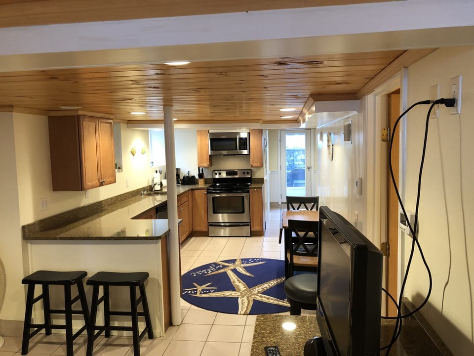 Open Kitchen with seating at breakfast bar and table