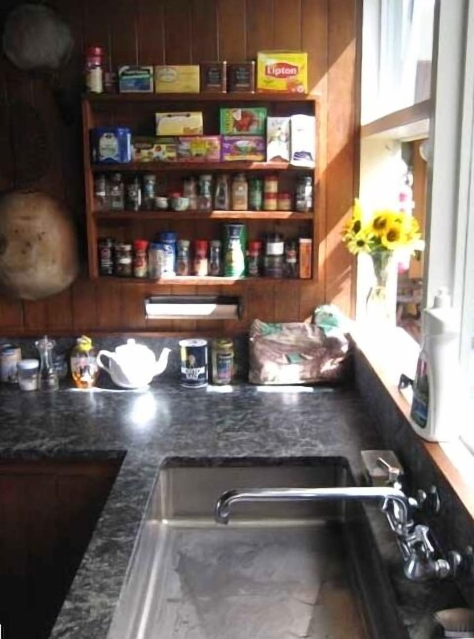 soapstone counter and custom sink in kitchen overlooks the large central porch