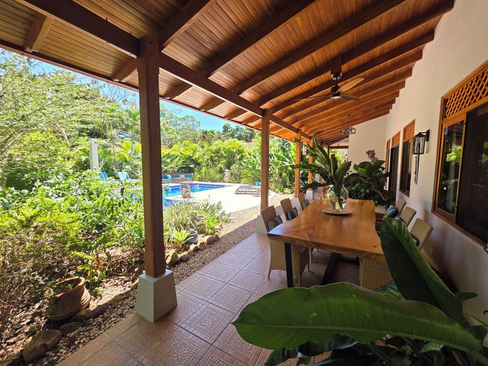 Poolside porch with dining and bbq area