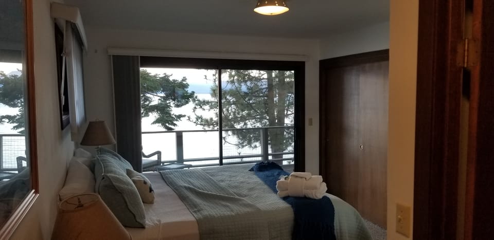 The king room upstairs has a king bed, shared porch, and private bath. 