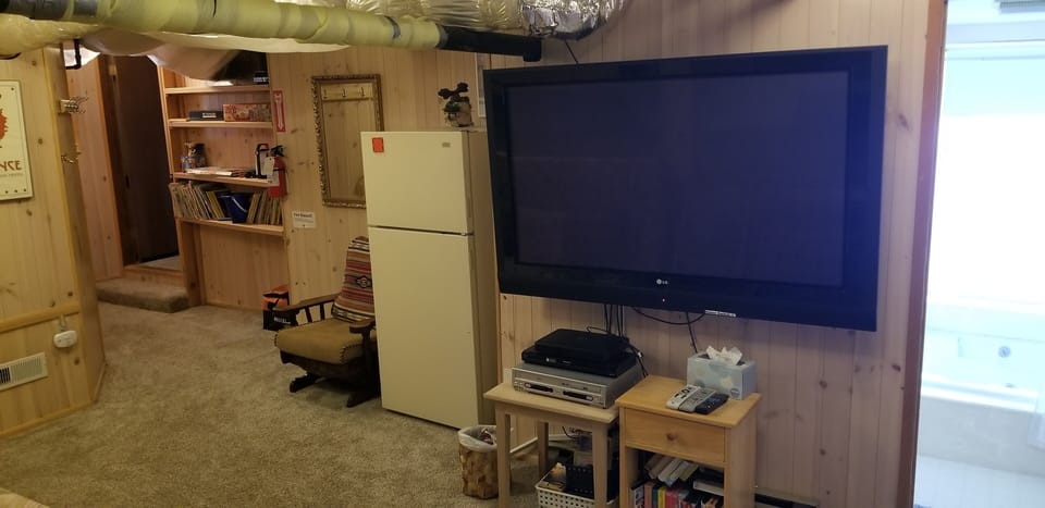 The playroom is a semifinished basement, with some pipes and things visible.