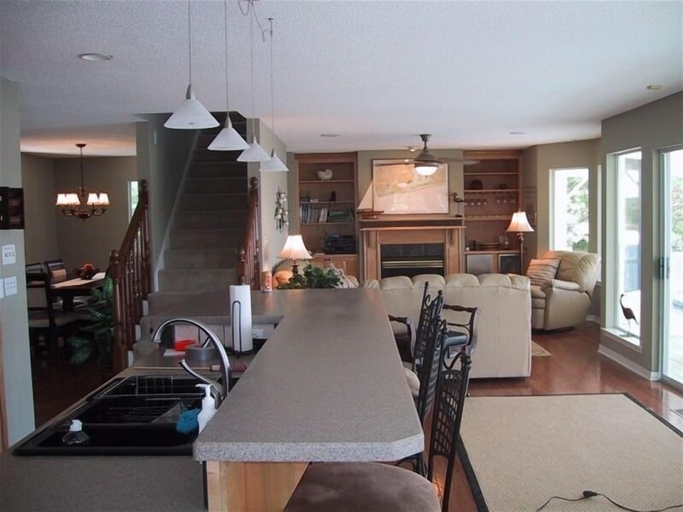 View from kitchen into dining room on left and living room on right