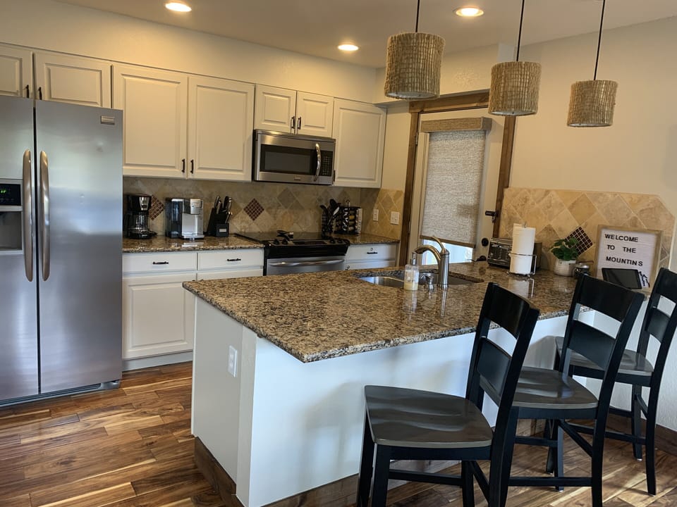 Fully stocked kitchen with all stainless steel appliances