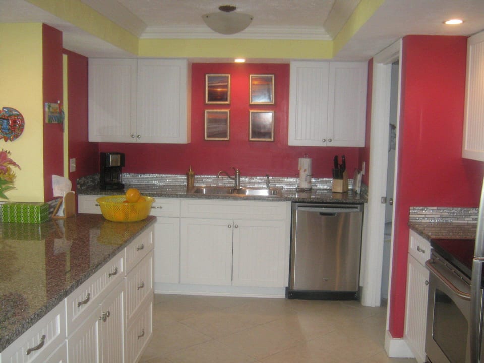 Recently updated kitchen with raised ceiling and granite counter tops