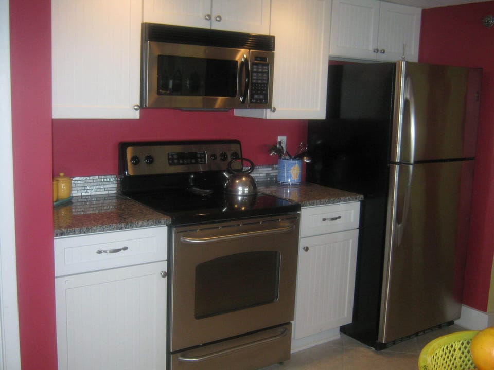stainless steel appliances and all the cooking and baking utensils you need