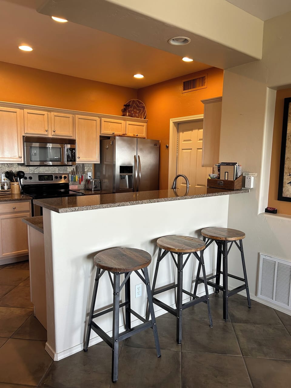 Kitchen/bar area opens to living area