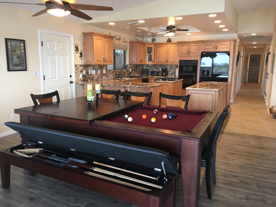 Large dining table converts into a pool table.