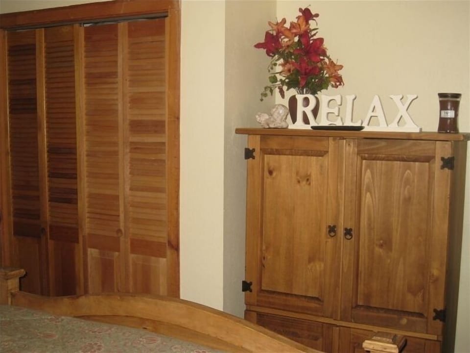 32 Inch Flat screen TV and Ipod doc in room.