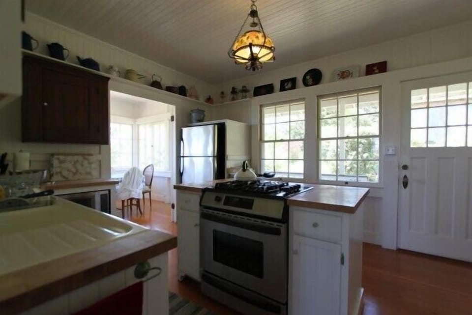 Kitchen with island stove and seating