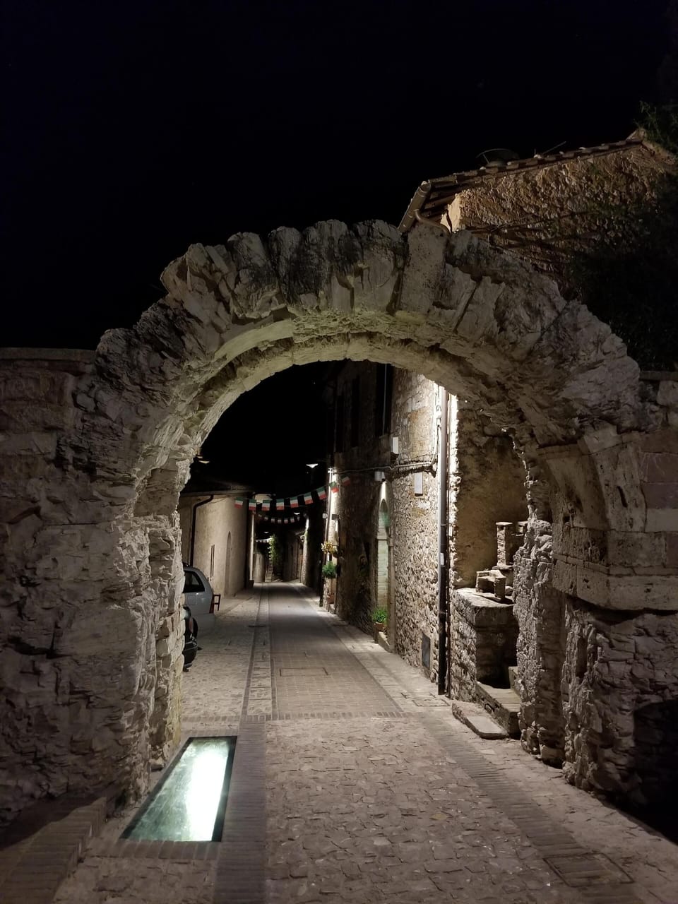 illuminated Spello arch