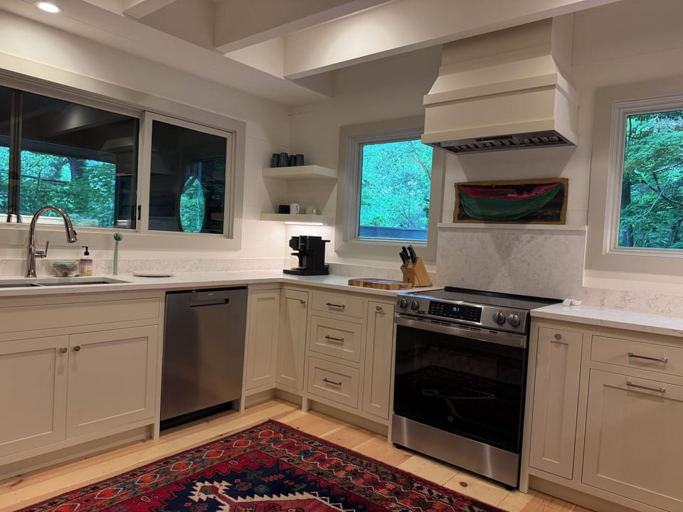 Windows over the sink look toward the porch/lake.