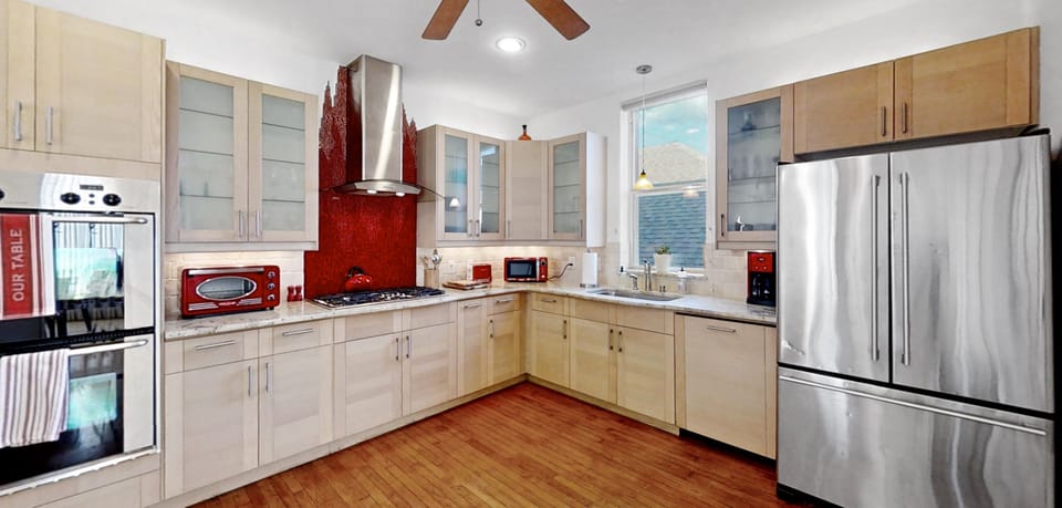 Full kitchen with pots, pans, plates, glasses etc.  High end appliances.