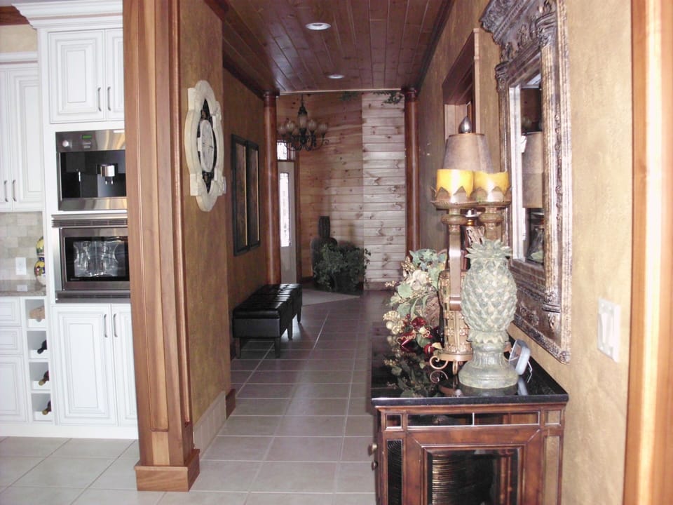 Hallway to Master bedroom; bathroom; office; laundry and front entrance.