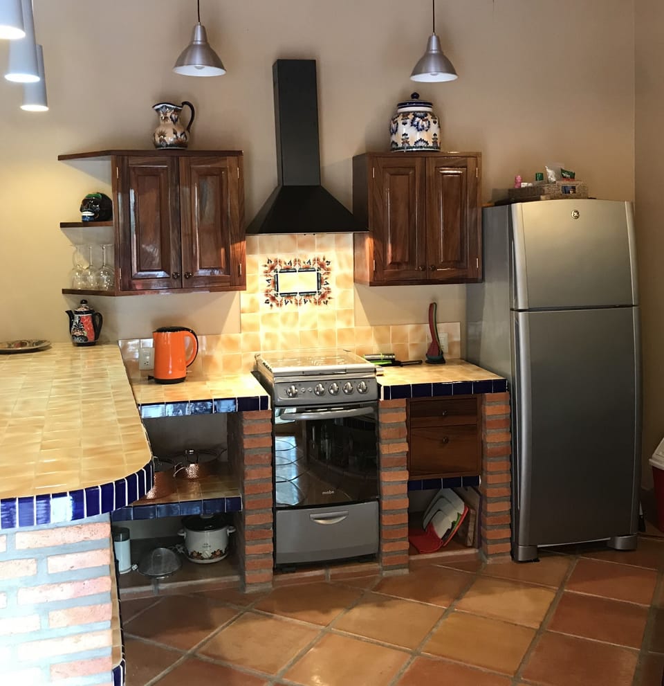 Gas range, stove, electric kettle, copper pots and pans, plenty of counter space