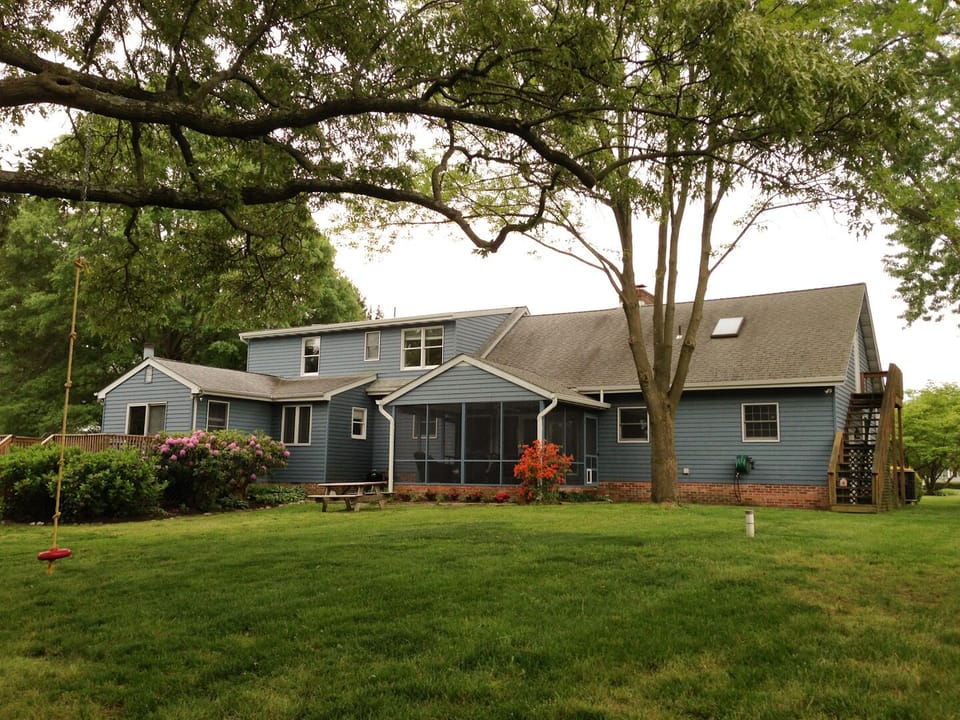 Enjoy our back yard under the shade of a sprawling White Oak tree