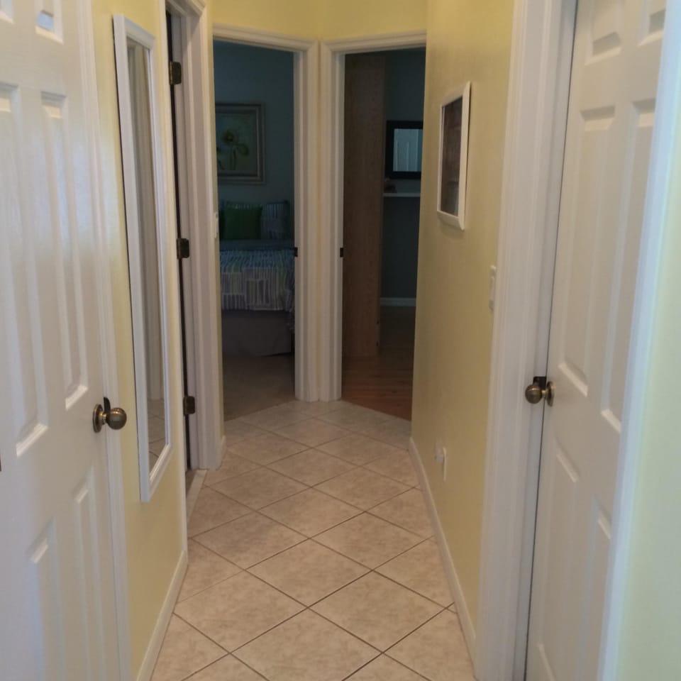 Hallway down to guests rooms, bath, & laundry room.