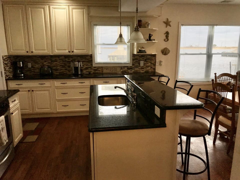 Kitchen with center island and water views 