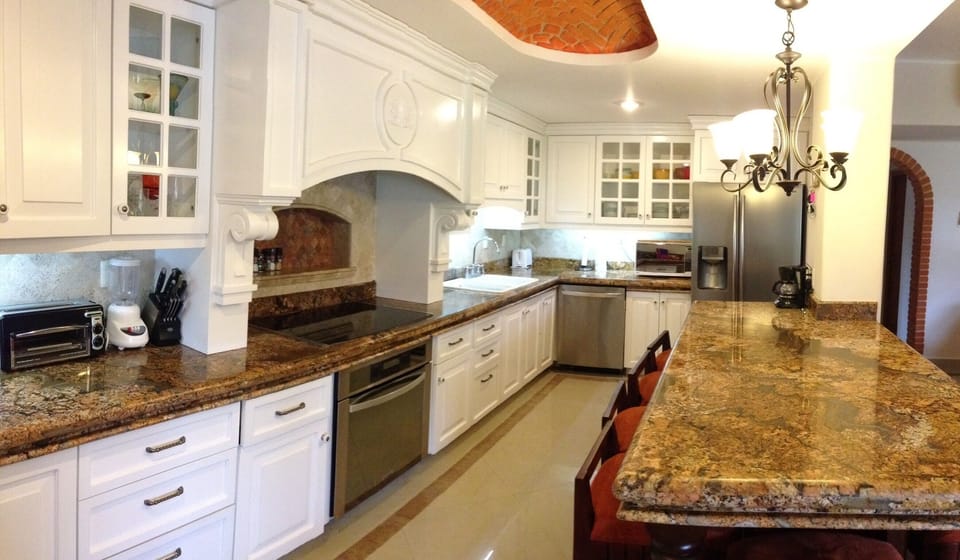 Gourmet kitchen (huge) with seating for eight. Beautiful granite!