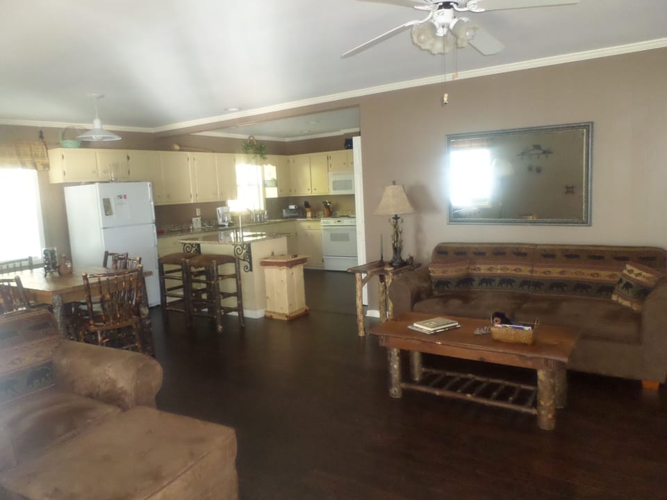 Living room with rustic furniture.   Hardwoods throughout.