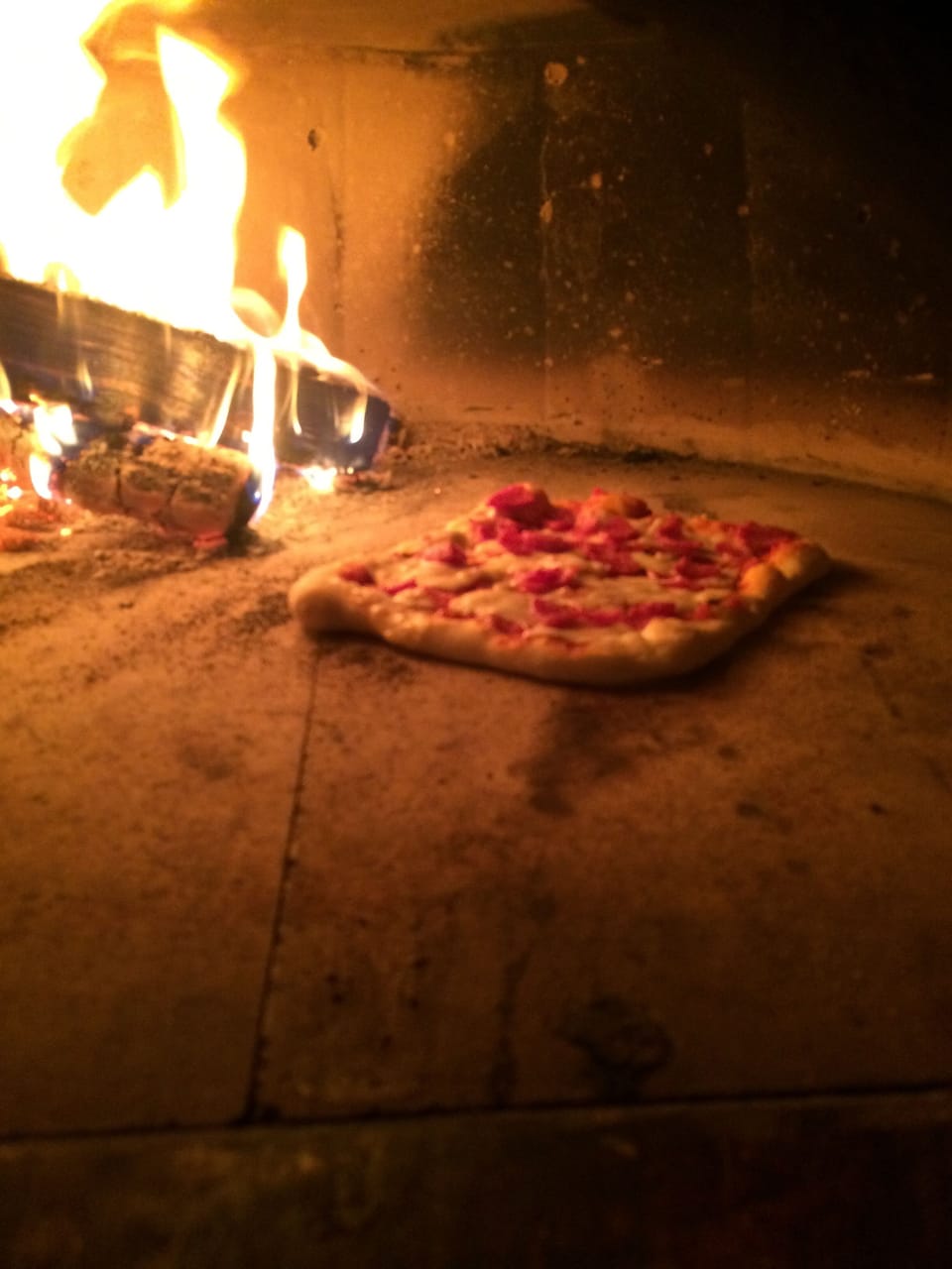 Pizza in the wood burning oven.