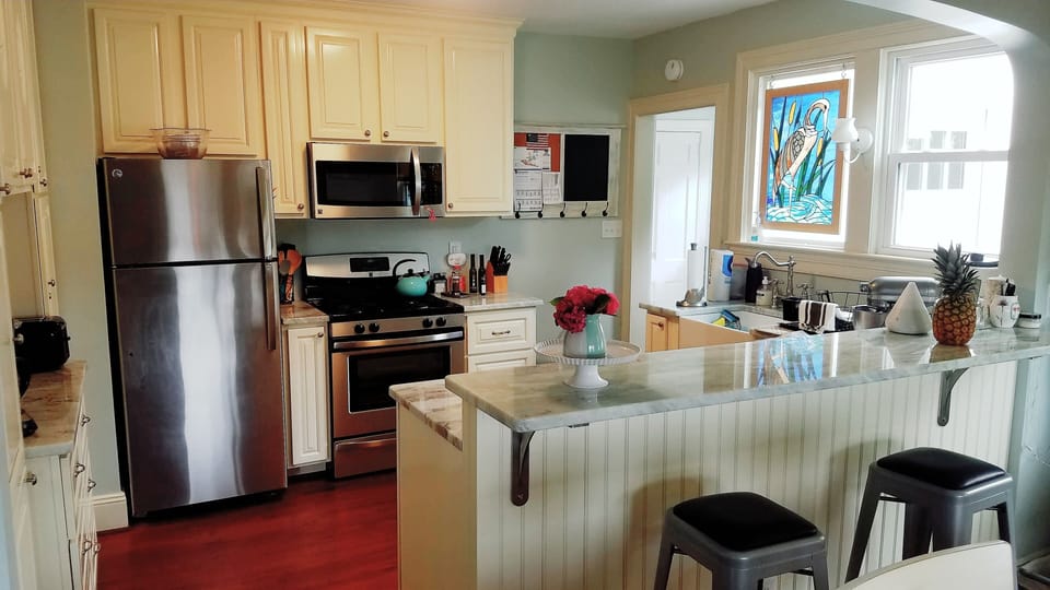 Modern kitchen with all new appliances and a view of the water. 