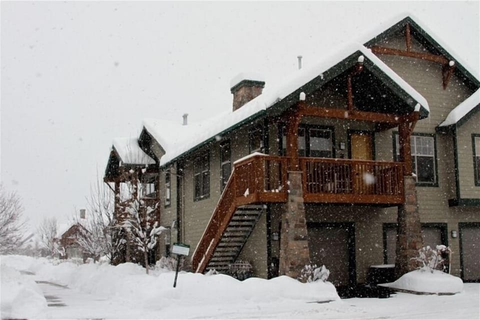 Outside. Walk in through garage or up stairs to deck.