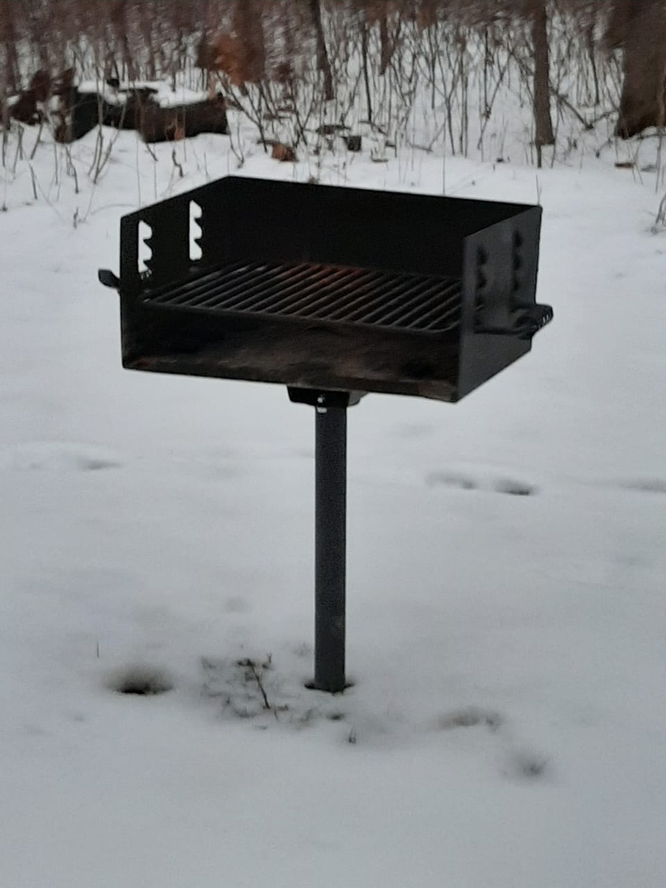 Camp style charcoal grill.