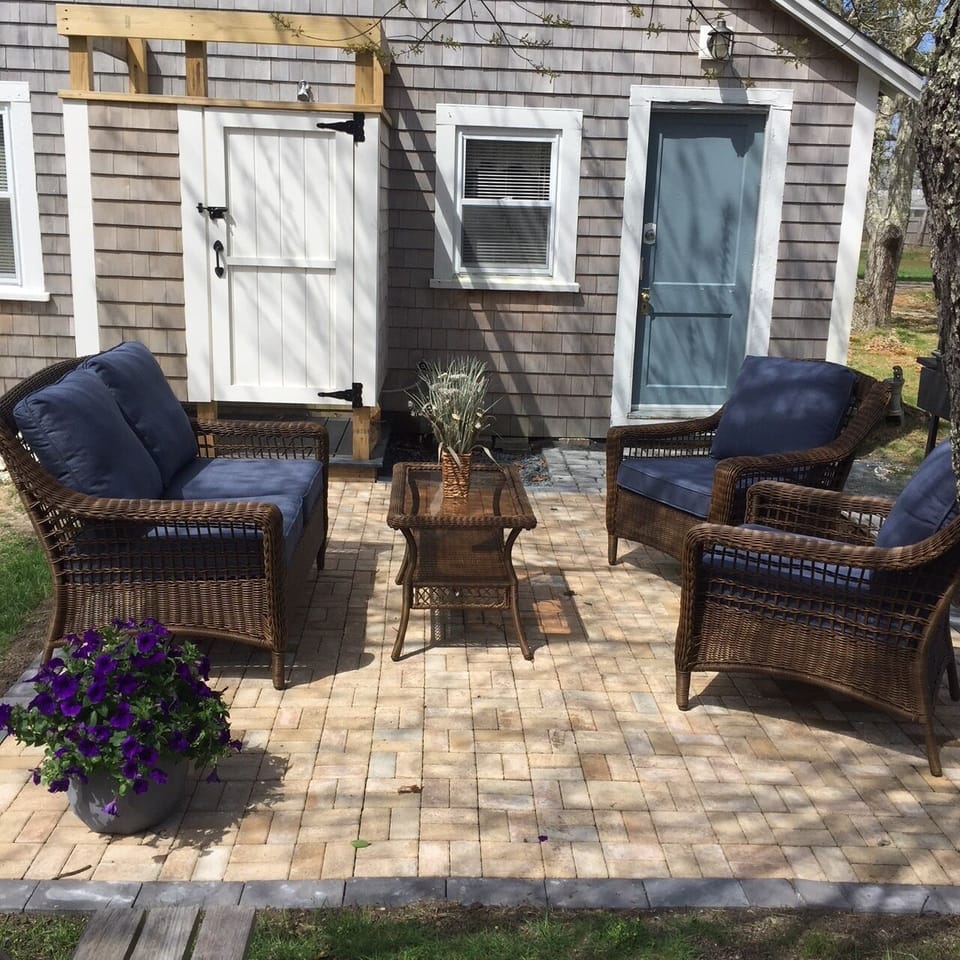 Inviting patio for coffee or cocktails. Custom outdoor shower off patio.