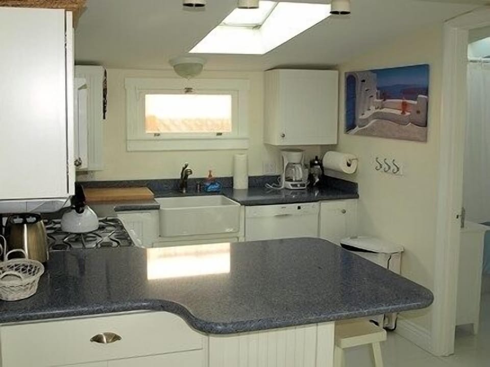 New kitchen, opens to dining area and backyard