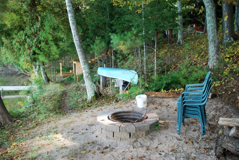 Fire Pit, Canoe, Life-Jacket Storage locker, next to the stairs.