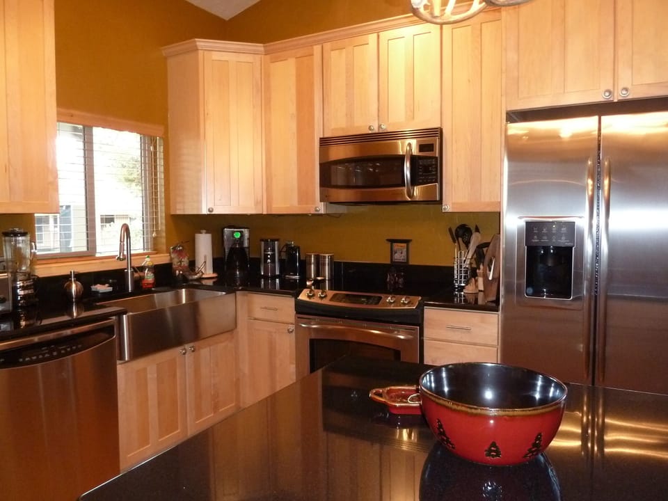 Kitchen and center island. Brand new stainless steel appliances/wine fridge.