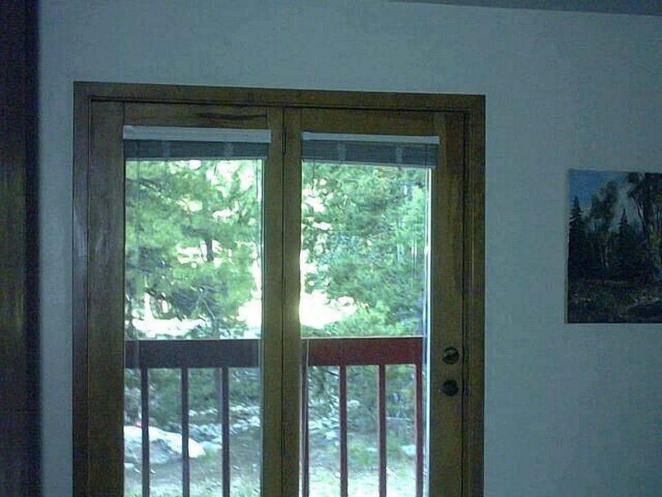 view from second bedroom french doors to national forest