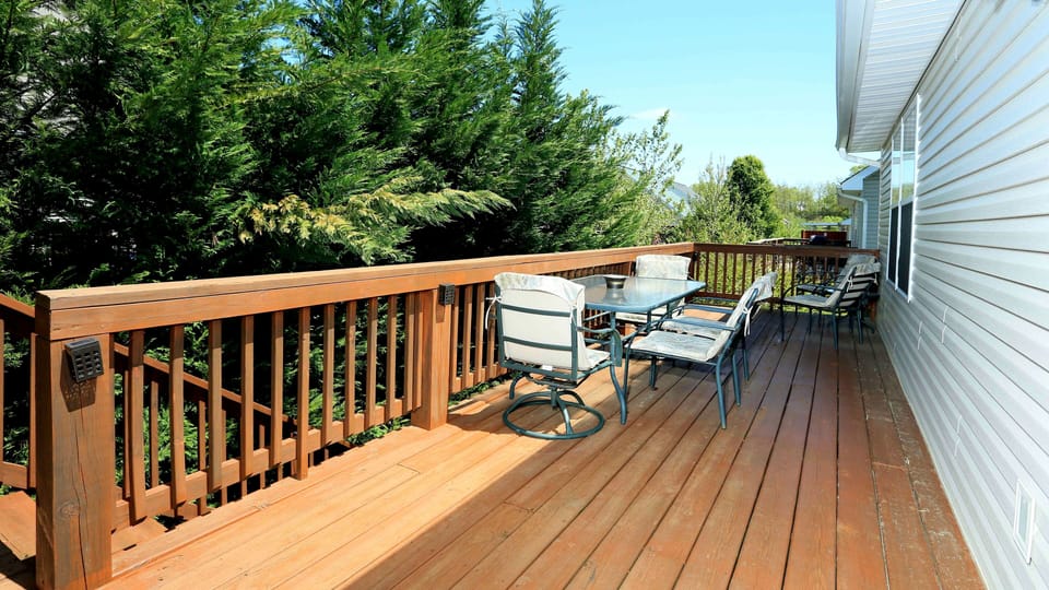 Back porch with outdoor chairs and table