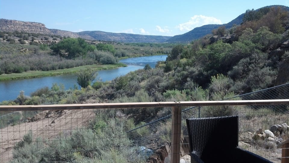 View of rapids on the river near the house. You can walk to the water.