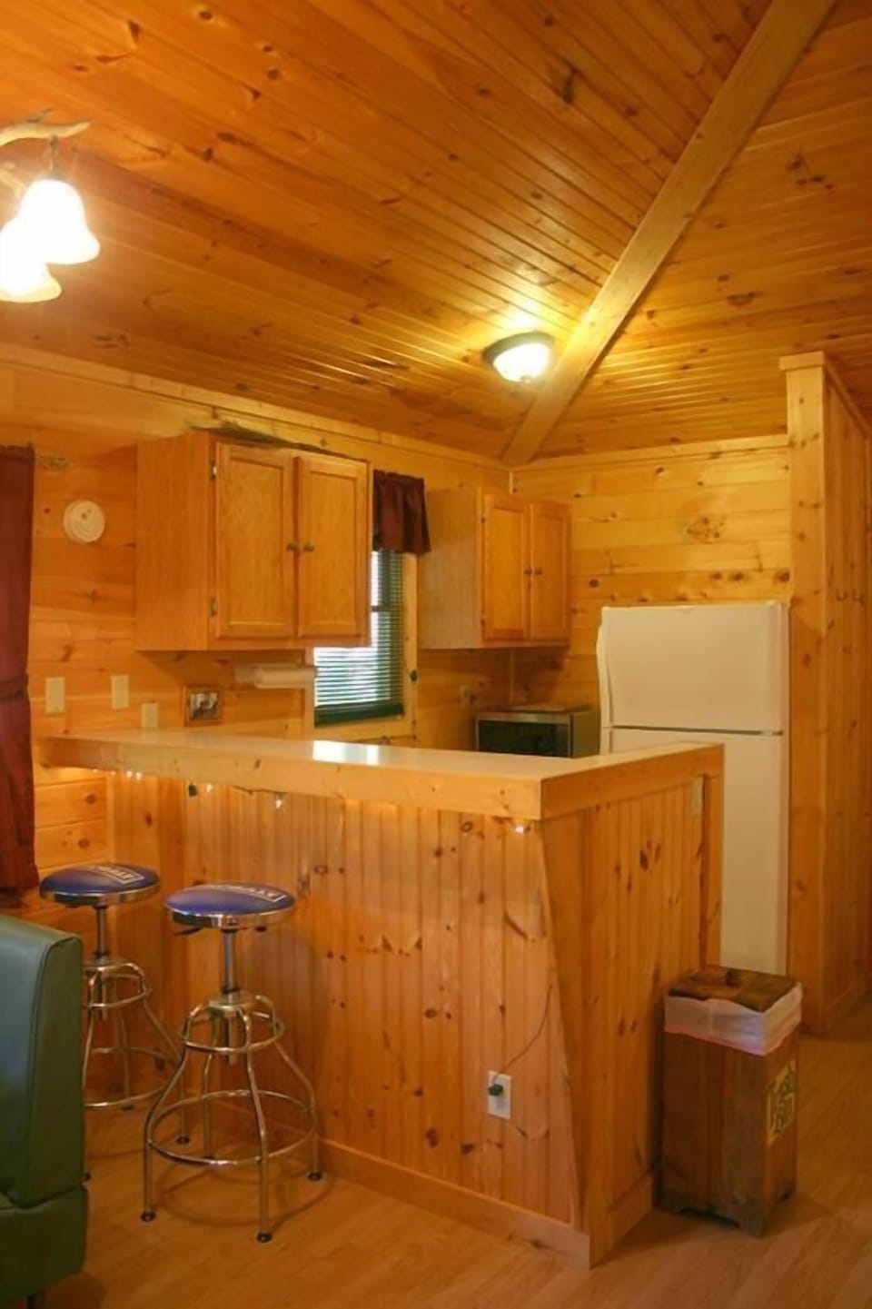 Wolfcreek Cabin Bar and Kitchen Area.  Notice the knotty pine cathedral ceiling.
