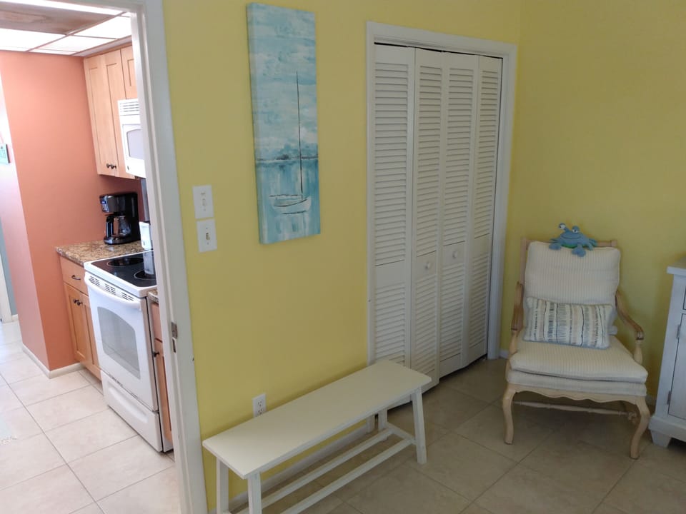 closet, sitting chair, and bench for luggage