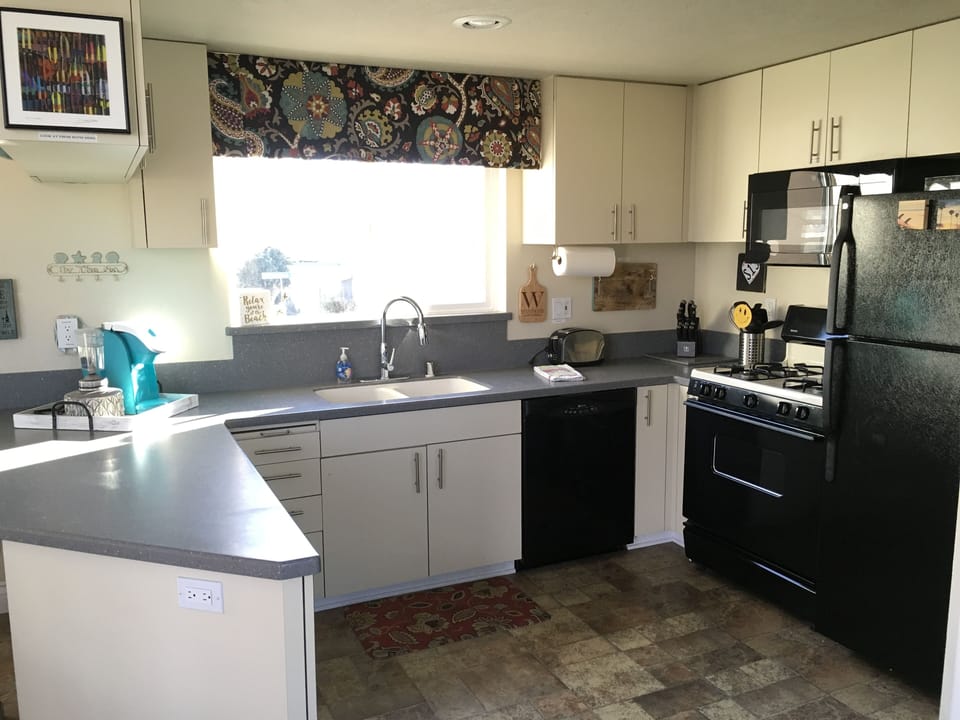 Kitchen has kuerig , ice maker in refrigerator...