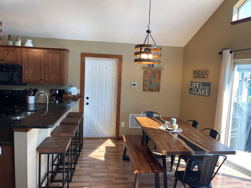 Dining table and bar has seating for 10 people.