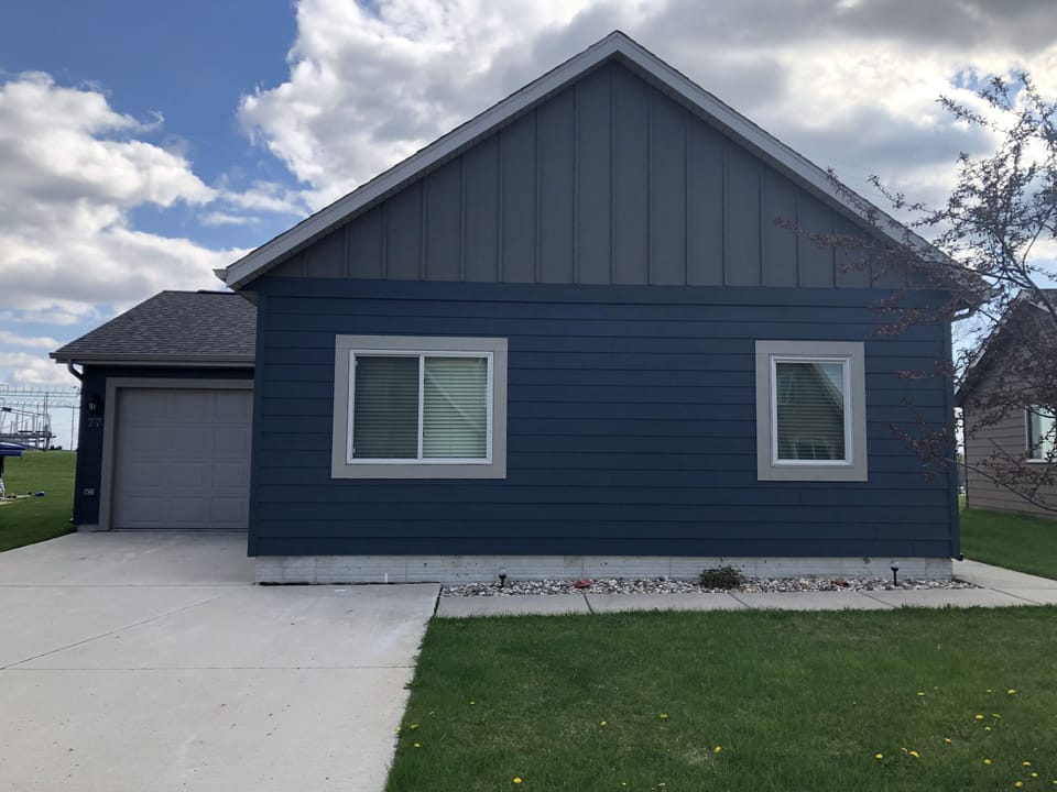 Single stall garage and driveway parking for approximately 3 cars.