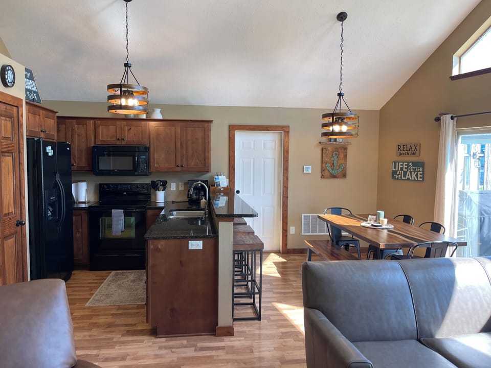 Open concept kitchen, dining and living area. Vaulted a-frame ceilings.