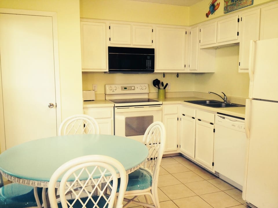 Fully stocked kitchen, open concept with a huge pantry for your groceries!  