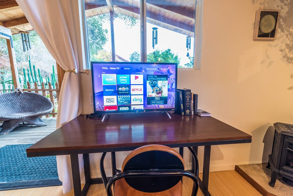 Roku TV with Netflix, Amazon Prime, Hulu, apps available.