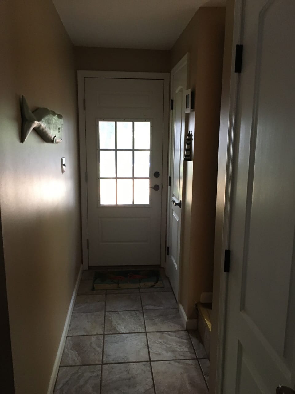 Entrance to laundry room and powder room from pool.