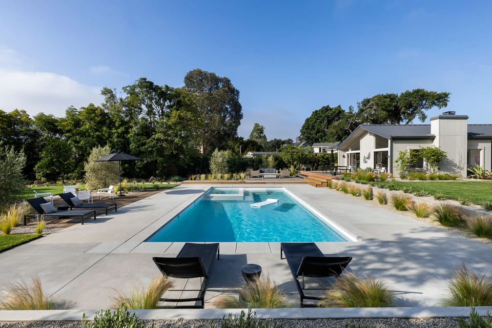 18X40 foot pool, spa and baja shelf.  Plenty of areas for dining and relaxing.
