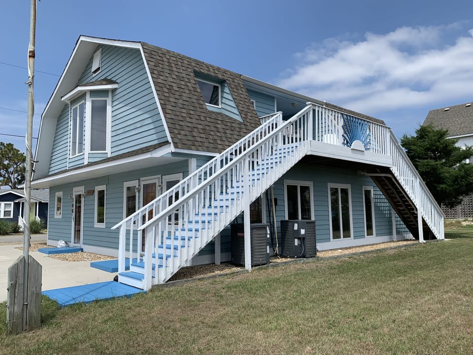 Side view of home with outside deck